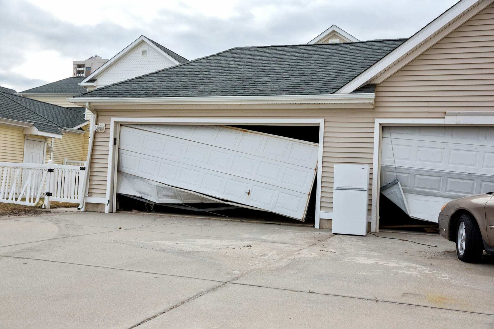 Garage door off its track and jammed, the kind of repair IronLift handles
