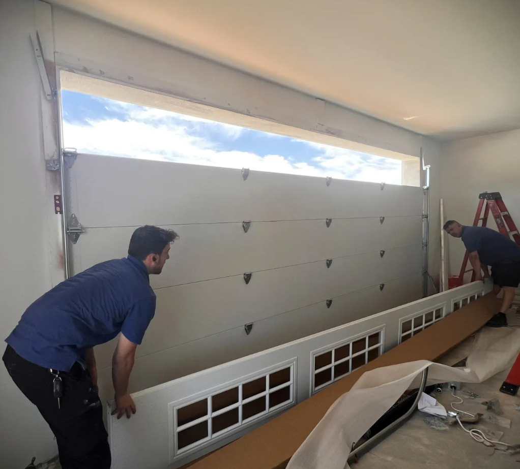 IronLift technicians installing a custom garage door in Melbourne